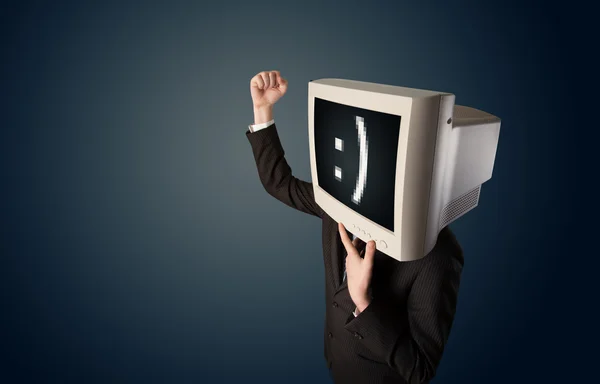 Funny young businessman with a monitor on his head and smiley on — Stock Photo, Image