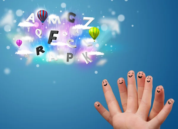 Happy smiley fingers looking at colorful magical clouds and ball — Stock Photo, Image