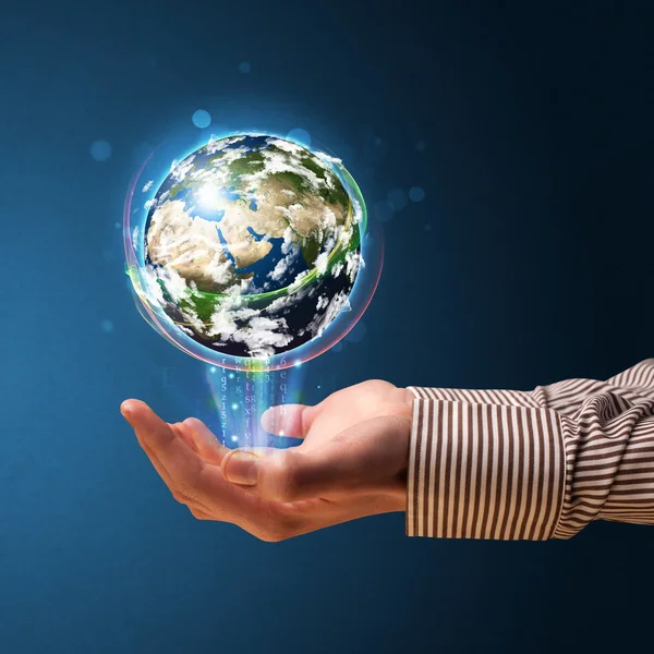 Businessman holding a glowing earth globe — Stock Photo, Image