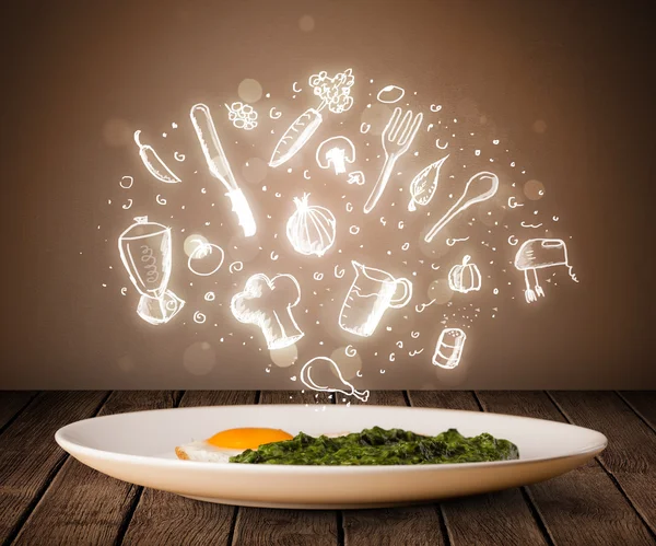 Plate of food with white kitchen icons — Stock Photo, Image