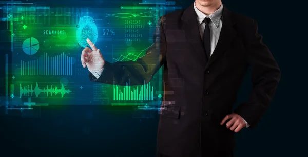 Jonge zakenman op moderne technologie paneel met vinger p te drukken — Stockfoto