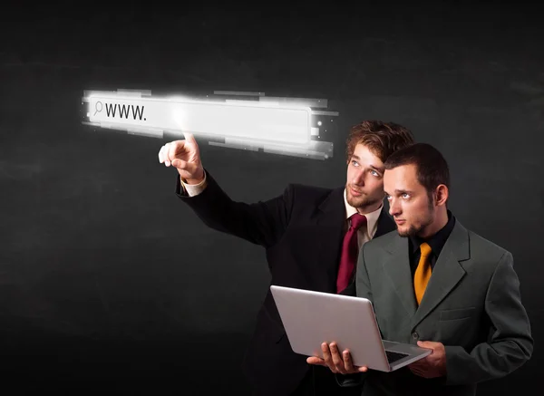 Young business people touching web browser address bar with www — Stock Photo, Image