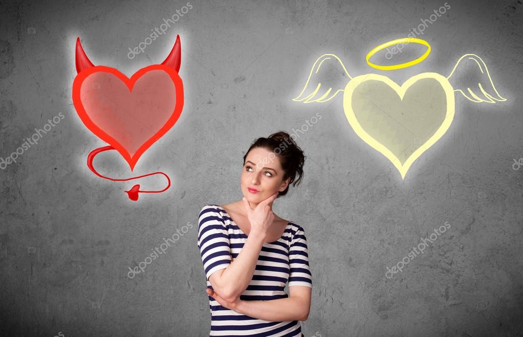 天使と悪魔の心の間に立っている女性 ストック写真 C Ra2studio