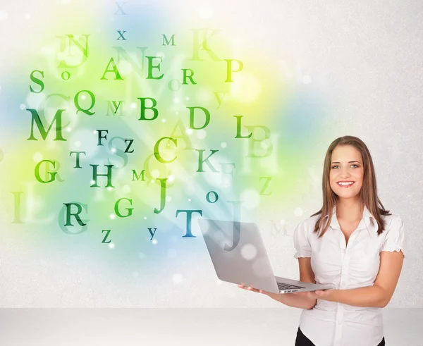 Business women with glowing letter concept — Stock Photo, Image