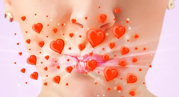 Pretty lady lips with lovely red hearts — Stock Photo, Image