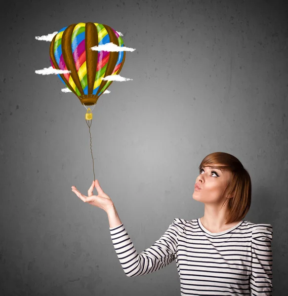 Woman holding a balloon drawing — Stock Photo, Image