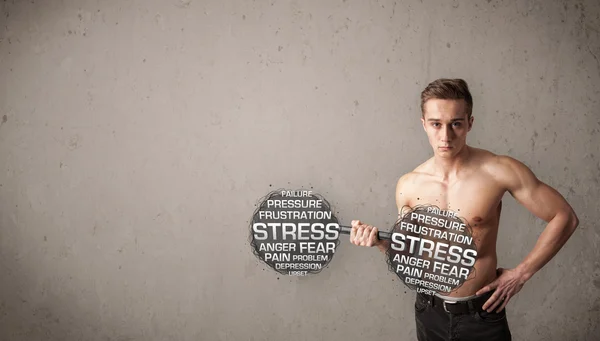 Muskulös man slåss med stress — Stockfoto