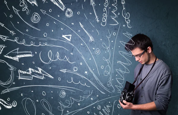 Photographer shooting images while energetic hand drawn lines an — Stock Photo, Image