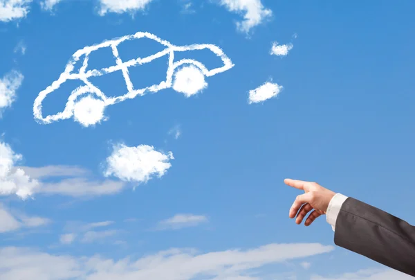 Mano apuntando a la nube del coche en un cielo azul — Foto de Stock