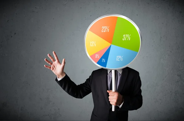 Businessman holding a pie chart — Stock Photo, Image