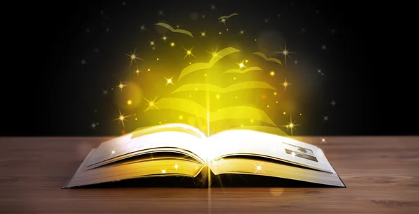 Open book with golden glow flying paper pages — Stock Photo, Image