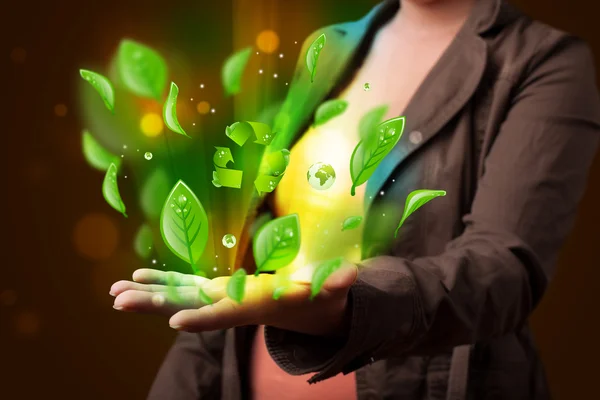 Young woman presenting eco green leaf recycle energy concept — Stock Photo, Image