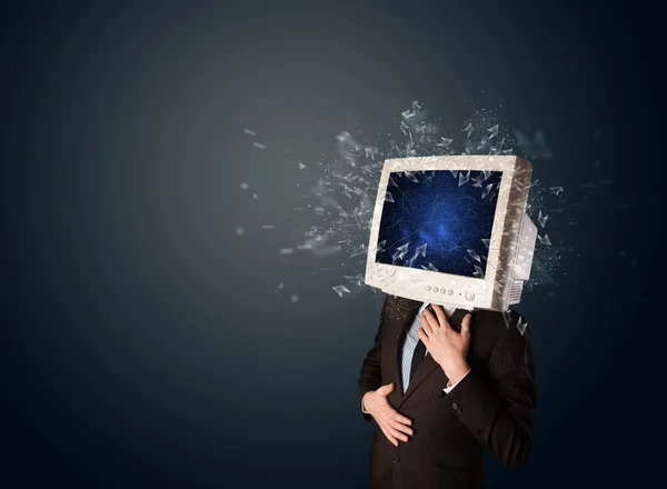 Computer monitor screen exploding on a young persons head — Stock Photo, Image