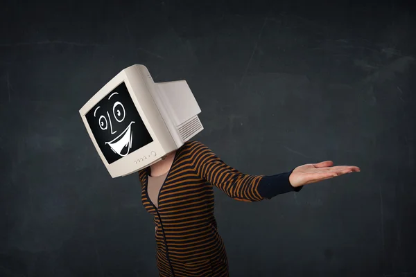 Girl with a monitor head and a cheerful cartoon face — Stock Photo, Image