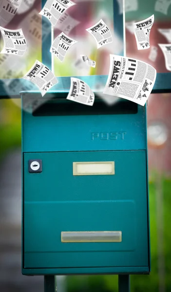 Post box with daily newspapers flying — Stock Photo, Image