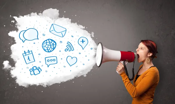 Woman shouting into loudspeaker and modern blue icons and symbol — Stock Photo, Image