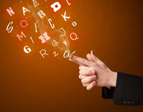 Letters coming out of gun shaped hands — Stock Photo, Image