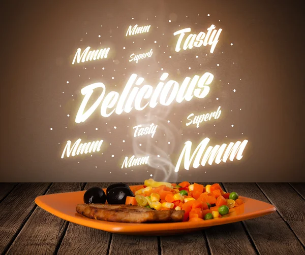 Food plate with delicious and tasty glowing writings — Stock Photo, Image