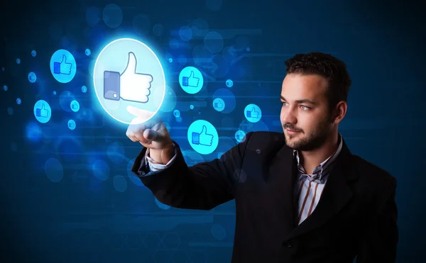 Handsome person pressing thumbs up button on modern social netwo — Stock Photo, Image