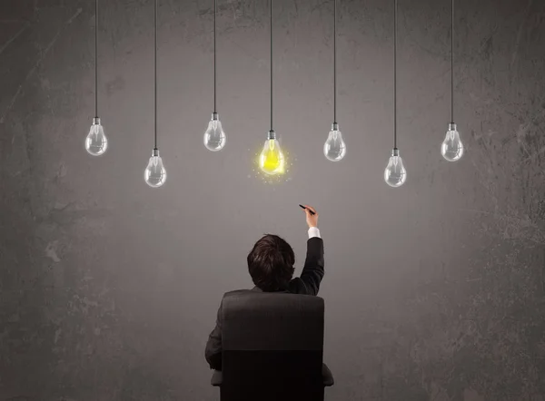 Businness guy in front of idea light bulbs concept — Stock Photo, Image