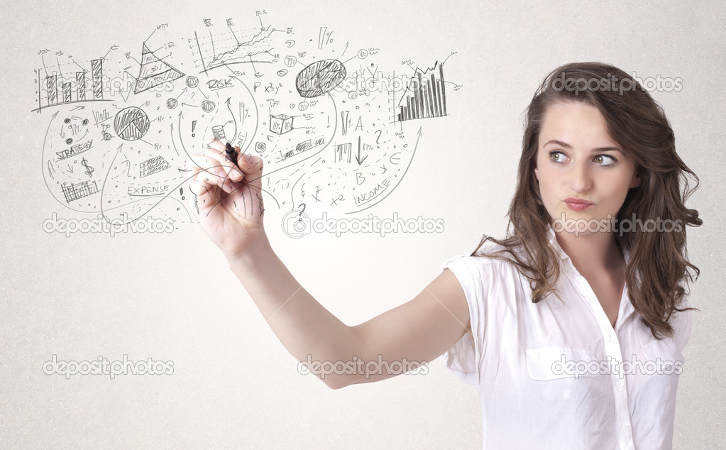 Pretty girl sketching graphs and diagrams on wall