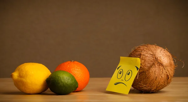 Coconut with post-it note communicating with citrus fruits — Stock Photo, Image