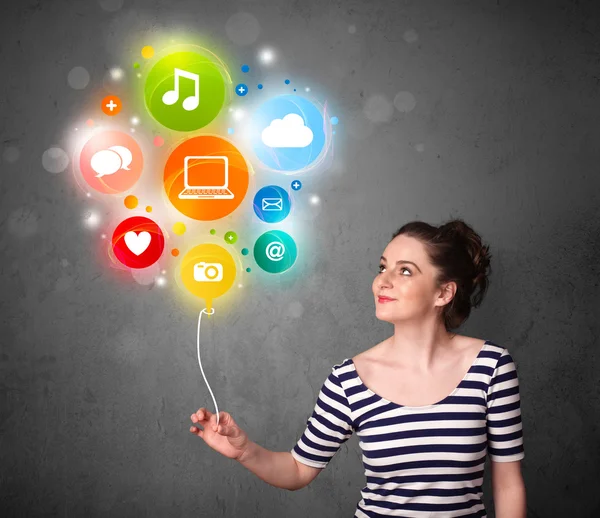 Woman holding social media balloon — Stock Photo, Image