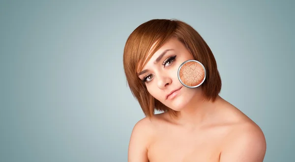 Beautiful young girl with magnifying glass of skin damage — Stock Photo, Image