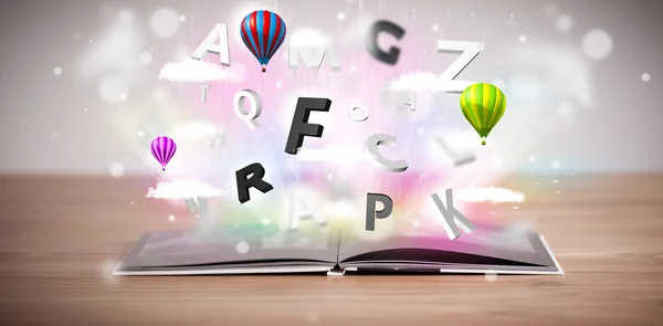Öppen bok med flygande 3D bokstäver på konkret bakgrund — Stockfoto