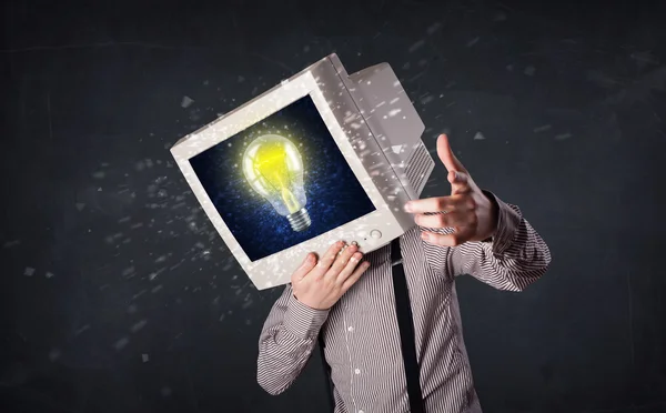 Business man with a pc monitor head and idea light bulb in the d — Stock Photo, Image