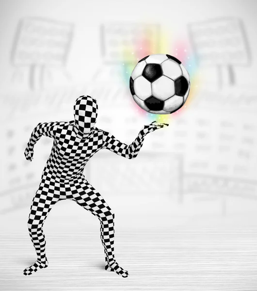 Man in full body suit holdig soccer ball — Stock Photo, Image