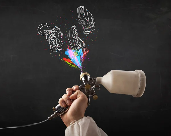 Man with airbrush spray paint with car, boat and motorcycle draw — Stock Photo, Image