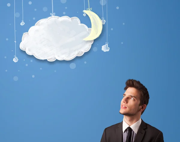 Businessman looking at cartoon night clouds with moon — Stock Photo, Image