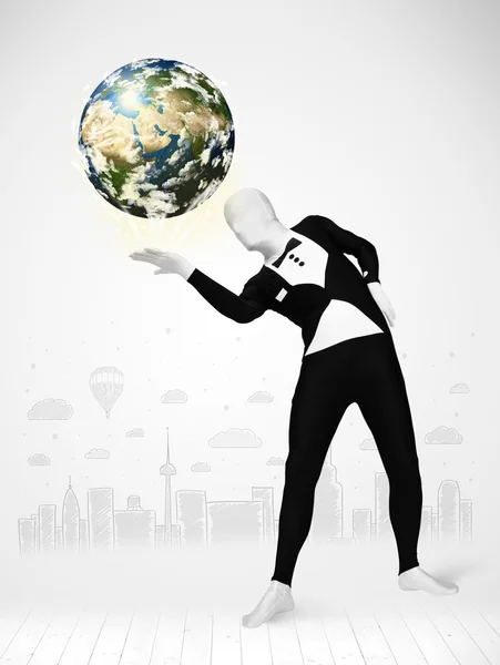 Man in full body suit holding planet earth — Stock Photo, Image