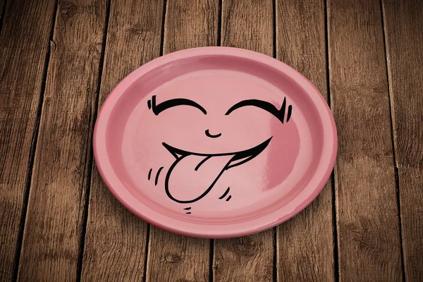 Щасливий смайлик мультфільм обличчя на барвистій тарілці — стокове фото
