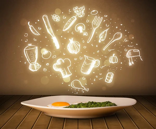 Plate of food with white kitchen icons — Stock Photo, Image