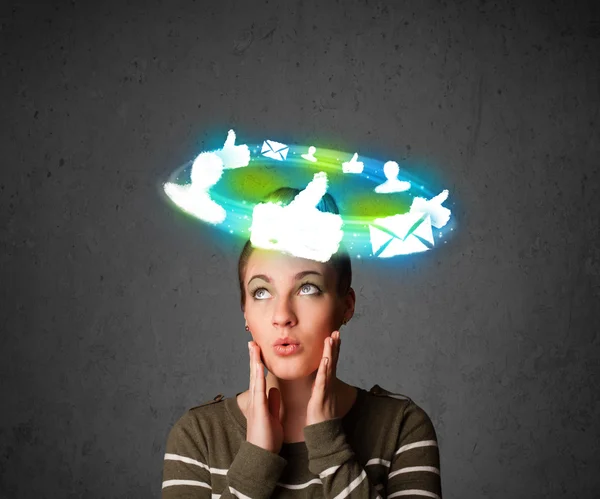 Young teenager with cloud social icons around her head — Stock Photo, Image