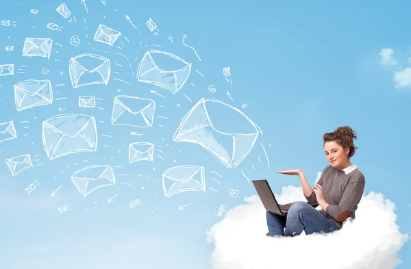 Young woman sitting in cloud with laptop — Stock Photo, Image