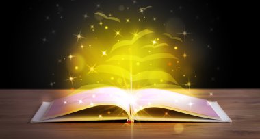 Altından parlak uçan kağıt sayfaları olan açık bir kitap