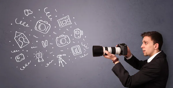 Jonge fotograaf schieten fotografie pictogrammen — Stockfoto