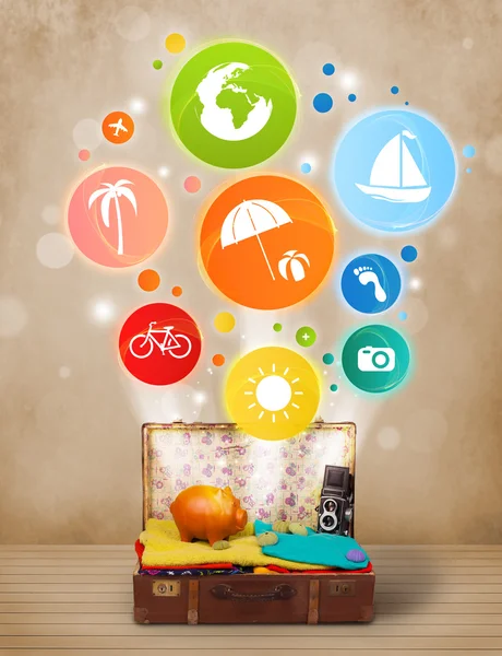 Suitcase with colorful summer icons and symbols — Stock Photo, Image