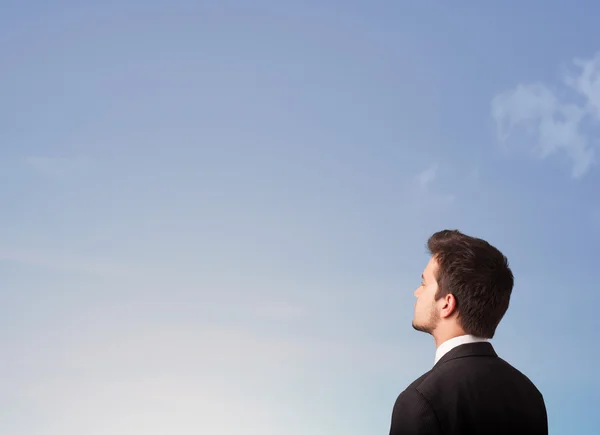 Handsome man looking at the blue sky copyspace — Stock Photo, Image
