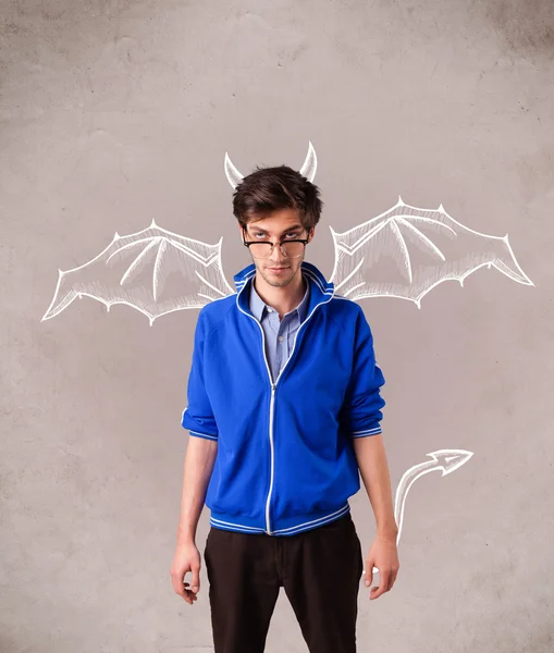 Young man with devil horns and wings drawing — Stock Photo, Image