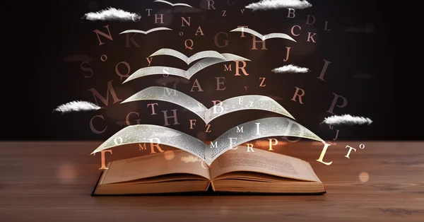 Pages and glowing letters flying out of a book — Stock Photo, Image