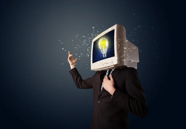 Business man with a pc monitor head and idea light bulb in the d — Stock Photo, Image