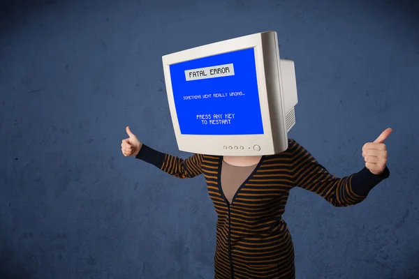 Person with a monitor head and fatal error blue screen on the di — Stock Photo, Image