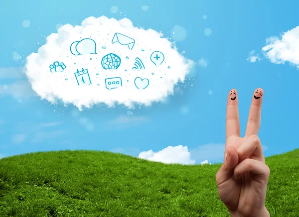 Happy smiley fingers looking at cloud with blue social icons and — Stock Photo, Image