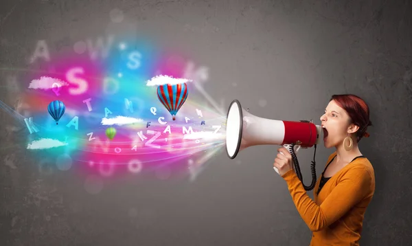 Girl shouting into megaphone and abstract text and balloons come — Stock Photo, Image