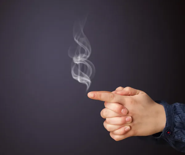 Gun shaped woman hand — Stock Photo, Image