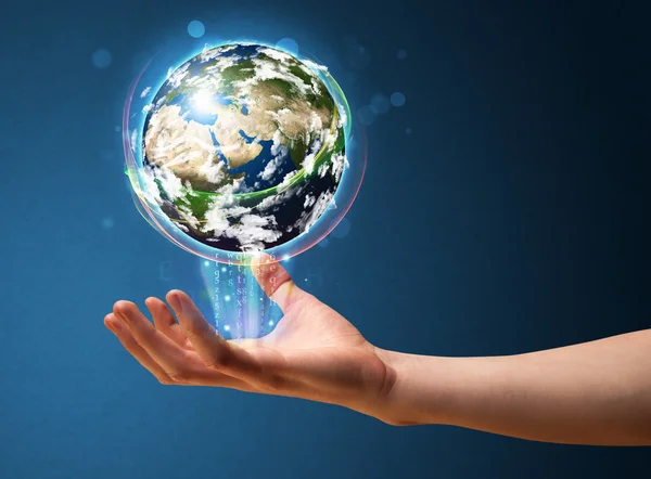 Businessman holding a glowing earth globe — Stock Photo, Image